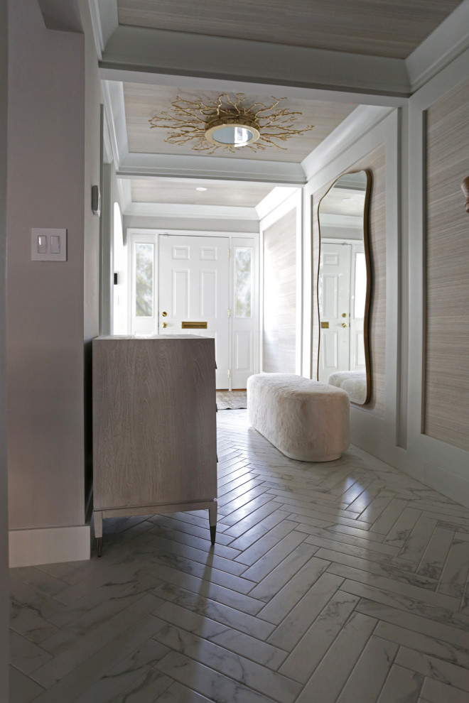 Mid-sized transitional l-shaped marble floor kitchen photo in DC Metro with an undermount sink, shaker cabinets, white cabinets, quartzite countertops, white backsplash, quartz backsplash and stainless steel appliances