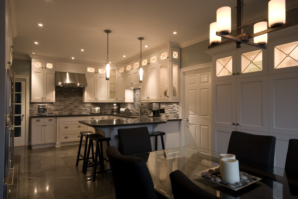 Eat-in kitchen - transitional u-shaped marble floor eat-in kitchen idea in Toronto with an undermount sink, recessed-panel cabinets, white cabinets, quartz countertops, multicolored backsplash, glass tile backsplash, stainless steel appliances and a peninsula
