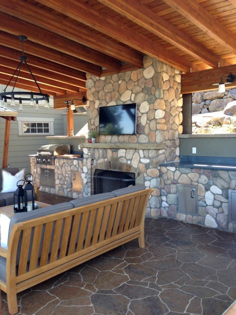 Example of a mid-sized transitional side yard concrete paver home design design in Seattle with a gazebo