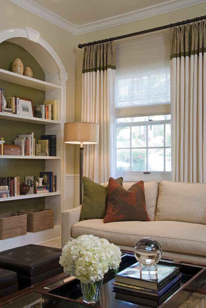 Design ideas for a traditional living room in Los Angeles with a library and beige walls.