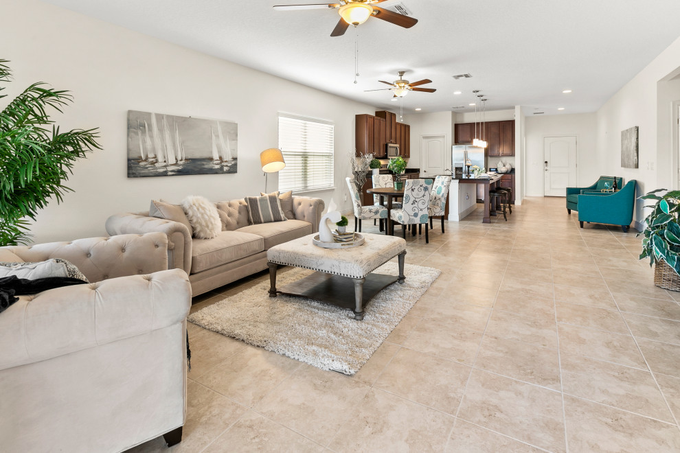 Small transitional open concept living room in Orlando with grey walls, ceramic floors and beige floor.