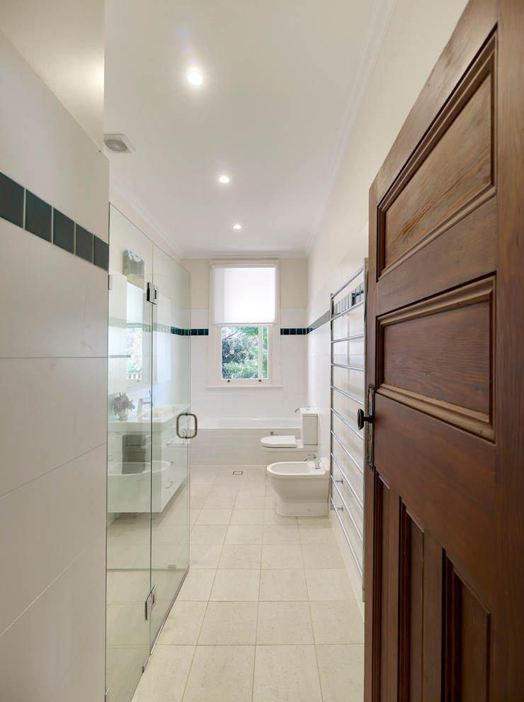 Design ideas for a mid-sized modern master bathroom in Sydney with a console sink, flat-panel cabinets, white cabinets, solid surface benchtops, a drop-in tub, a corner shower, a one-piece toilet, green tile, white walls and ceramic floors.