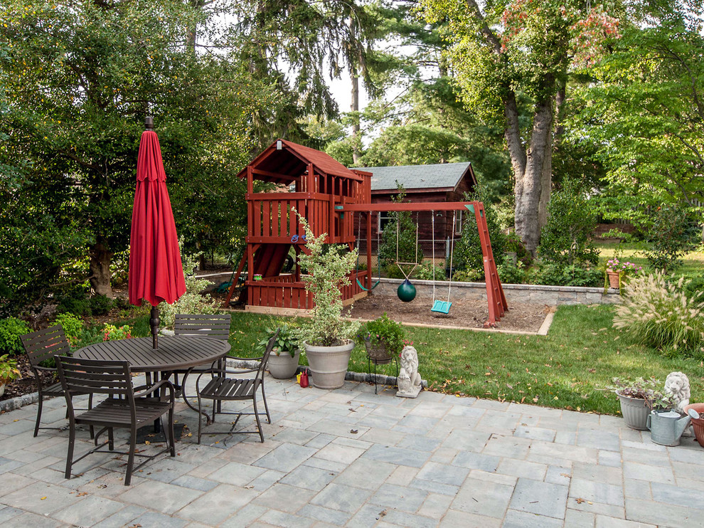Example of a mid-sized classic patio design in DC Metro with no cover