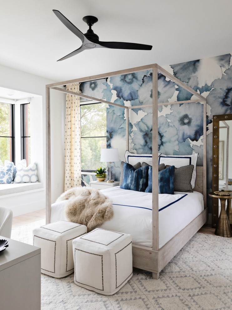 This is an example of a large transitional kids' room for girls in Orlando with light hardwood floors, wallpaper, blue walls and beige floor.