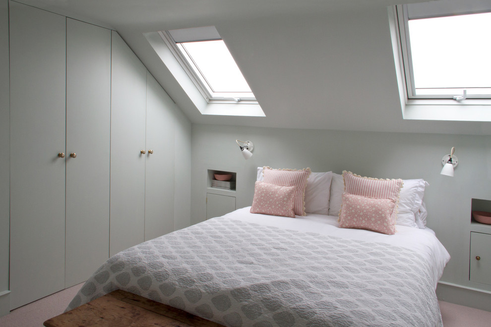This is an example of a mid-sized modern bedroom in London with beige floor and grey walls.