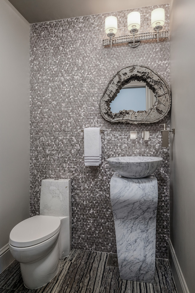 Design ideas for a mediterranean powder room in San Francisco with a one-piece toilet, multi-coloured tile, mosaic tile, grey walls, a vessel sink, marble benchtops, multi-coloured floor and white benchtops.
