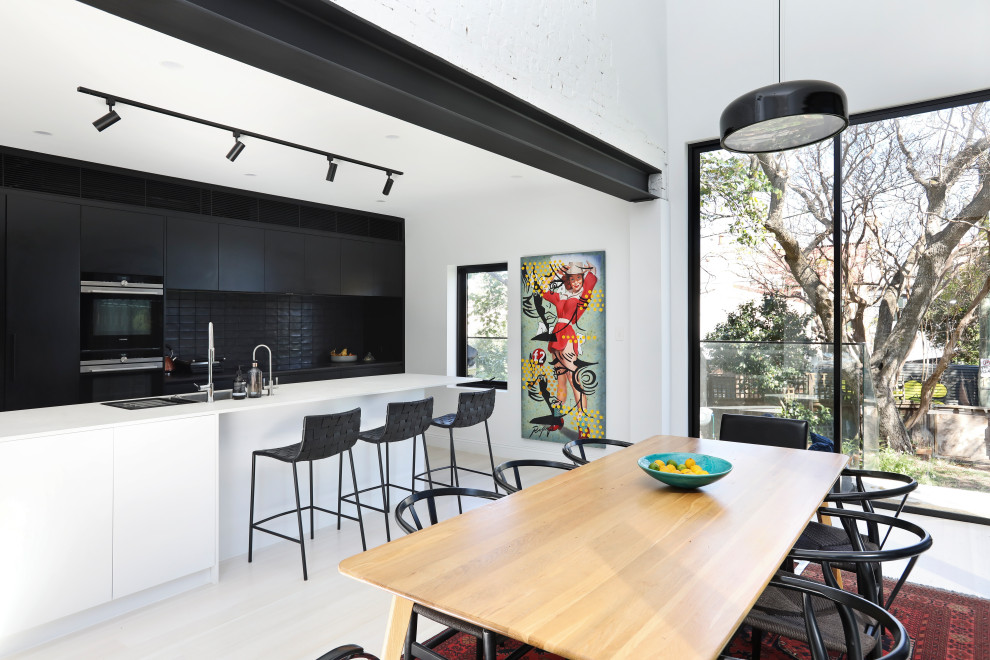 Design ideas for a contemporary open plan dining in Sydney with white walls, light hardwood floors and beige floor.