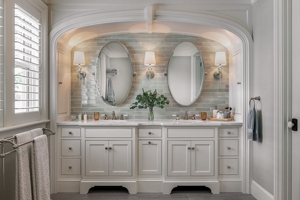 Beach style master gray tile and subway tile gray floor bathroom photo in Boston with beaded inset cabinets, white cabinets, gray walls, marble countertops and white countertops
