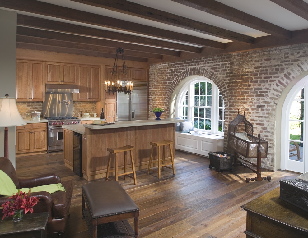 Photo of a traditional kitchen in Atlanta with dark hardwood floors and with island.
