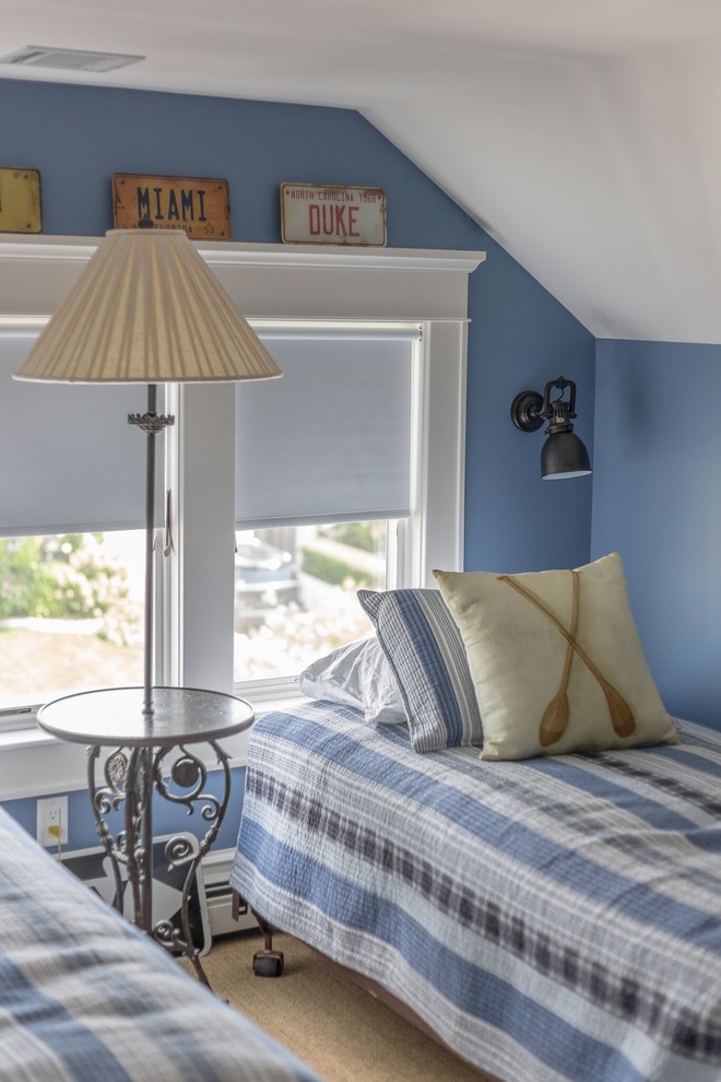 Photo of a mid-sized beach style guest bedroom in Other with blue walls, light hardwood floors, no fireplace and beige floor.