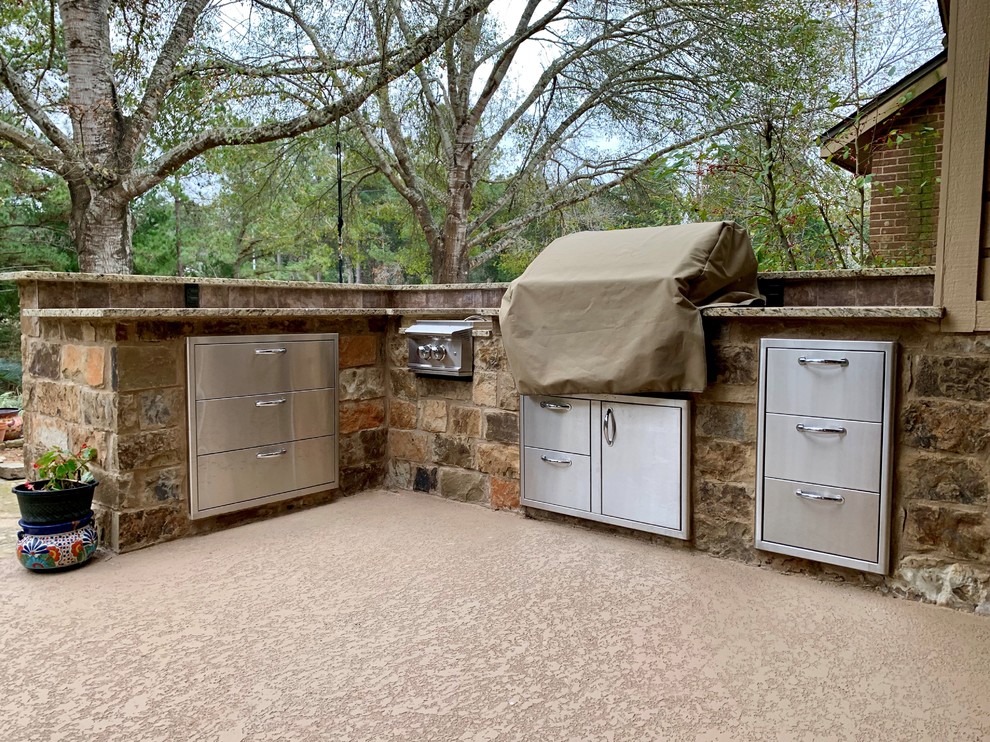 Inspiration for a mid-sized country backyard patio in Houston with an outdoor kitchen.