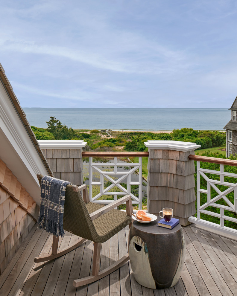 Inspiration for a coastal wood railing balcony remodel in Providence with no cover