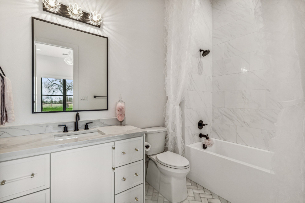 Inspiration for a medium sized contemporary family bathroom in Dallas with shaker cabinets, white cabinets, an alcove bath, a two-piece toilet, white tiles, ceramic tiles, pink walls, marble flooring, a submerged sink, engineered stone worktops, grey floors, grey worktops, a single sink and a built in vanity unit.