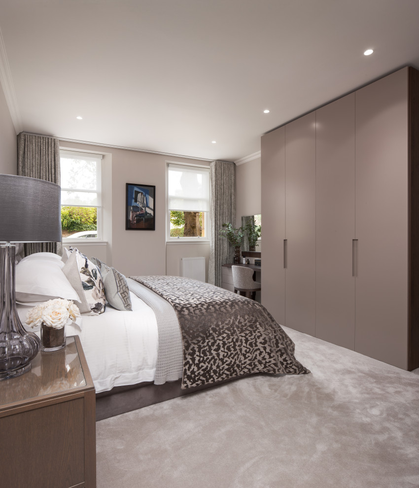 Large contemporary master bedroom in Glasgow with grey walls, carpet and grey floor.