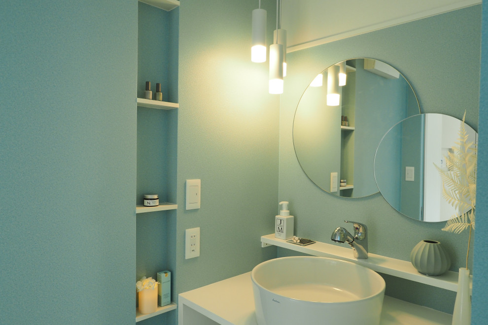 Contemporary cloakroom in Other with blue walls, white floors, a feature wall and a wallpapered ceiling.