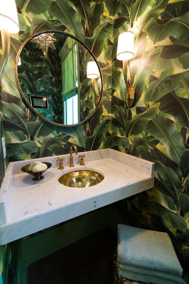 Mid-sized tropical powder room in Atlanta with green walls, an undermount sink, marble benchtops and white benchtops.