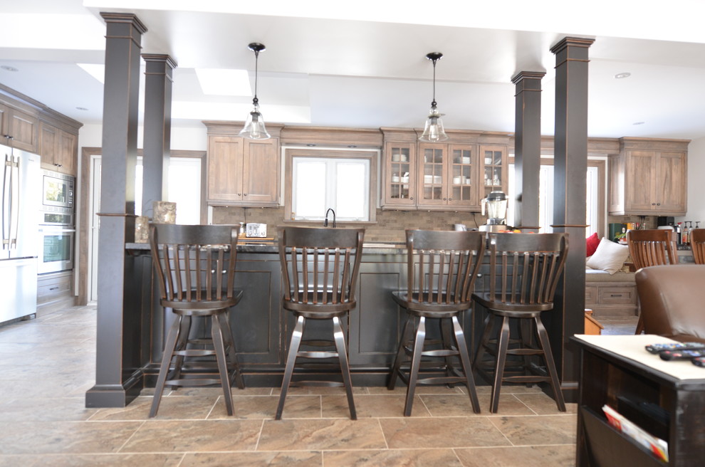 Example of a transitional kitchen design in Toronto
