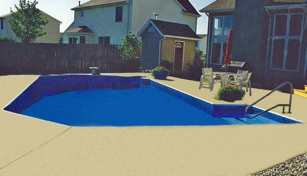 Example of a large backyard custom-shaped pool house design in Grand Rapids