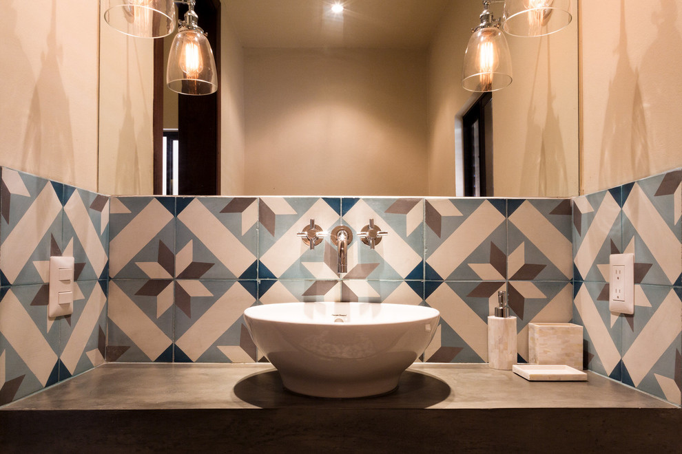 This is an example of a small contemporary powder room in Los Angeles with blue tile, brown tile, white tile, porcelain tile, beige walls, a vessel sink and concrete benchtops.