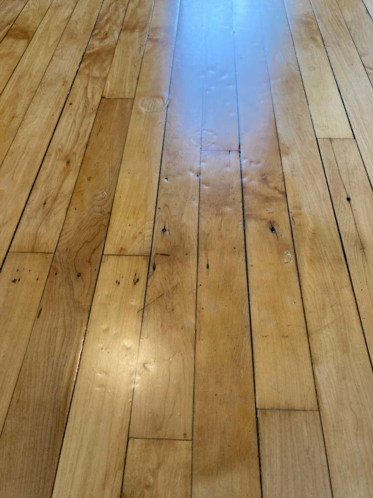 Fixing impressions in hardwood floor polyurethane