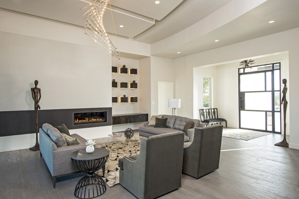 Inspiration for an expansive contemporary formal open concept living room in Austin with white walls, porcelain floors, a ribbon fireplace, a tile fireplace surround and no tv.