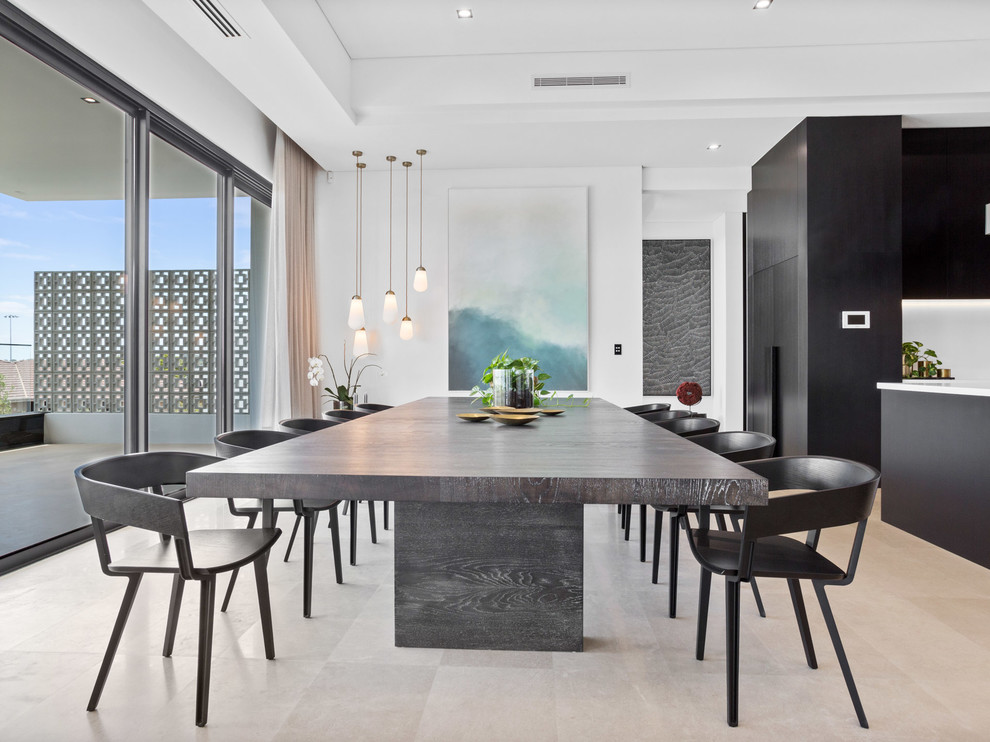 Contemporary kitchen/dining combo in Perth with white walls and beige floor.