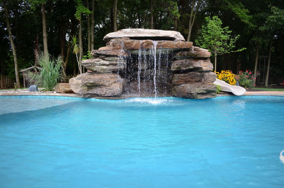 Huge transitional backyard concrete paver and custom-shaped natural pool fountain photo in DC Metro