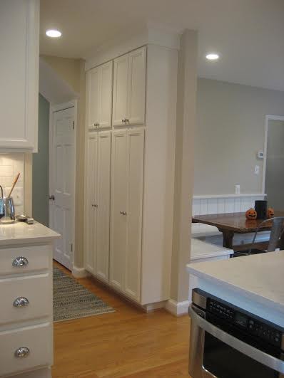 Photo of a traditional eat-in kitchen in DC Metro with an undermount sink and raised-panel cabinets.
