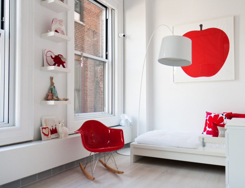 This is an example of a mid-sized modern kids' room for girls in New York with white walls.