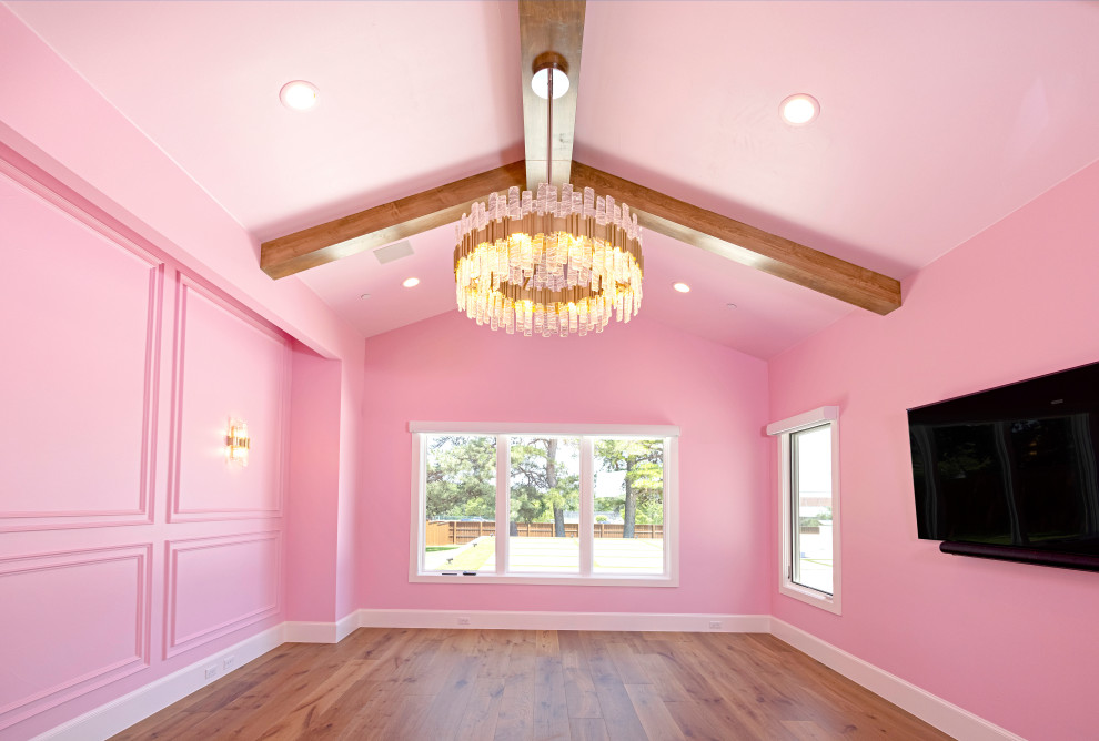 Large master bedroom in Dallas with pink walls.