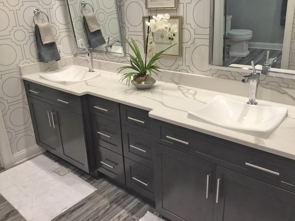 This is an example of a large transitional bathroom in Other with beaded inset cabinets, grey cabinets, ceramic floors and grey floor.