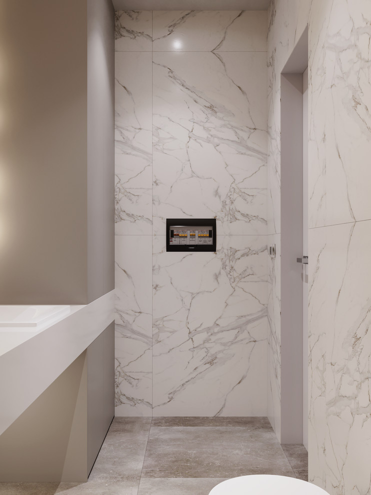 Inspiration for a small contemporary powder room in Valencia with flat-panel cabinets, grey cabinets, a wall-mount toilet, white tile, marble, white walls, porcelain floors, a wall-mount sink, solid surface benchtops, grey floor and white benchtops.
