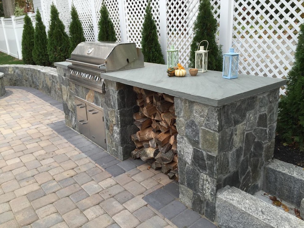 Mid-sized transitional backyard concrete paver patio photo in Orange County with a fire pit and no cover