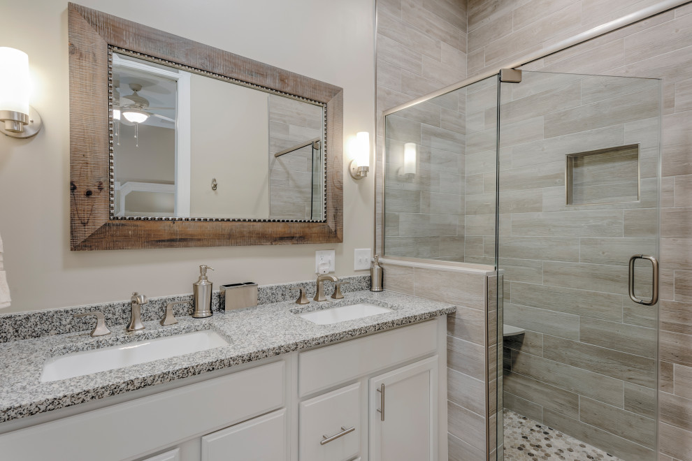 Mid-sized beach style master bathroom in Other with recessed-panel cabinets, white cabinets, beige walls, mosaic tile floors, an undermount sink, granite benchtops, multi-coloured floor, a hinged shower door and multi-coloured benchtops.