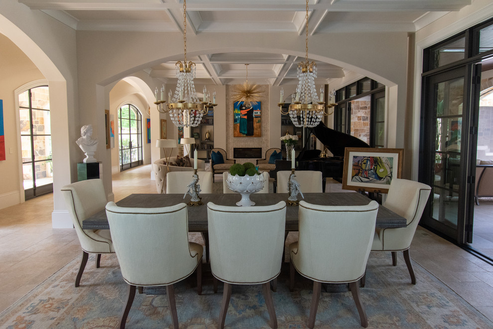 Design ideas for a mediterranean open plan dining in Charleston with beige walls and beige floor.
