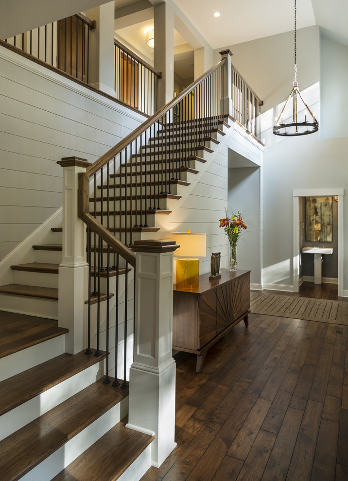This is an example of a transitional wood l-shaped staircase in Minneapolis with painted wood risers.