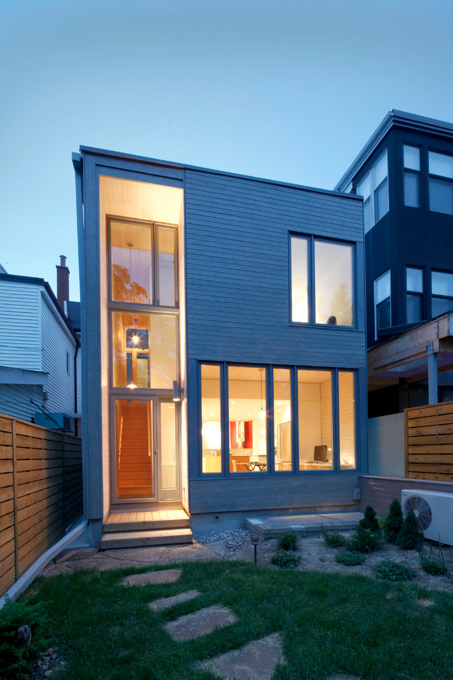 Inspiration for a contemporary exterior in Toronto with wood siding.