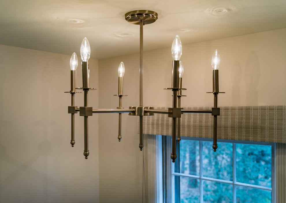 Example of a transitional home design design in Raleigh