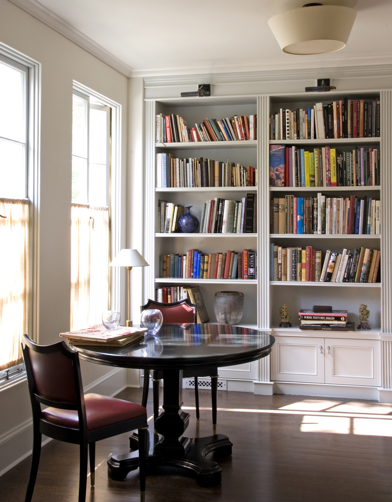 Inspiration for a traditional home office in Los Angeles with dark hardwood floors and a freestanding desk.