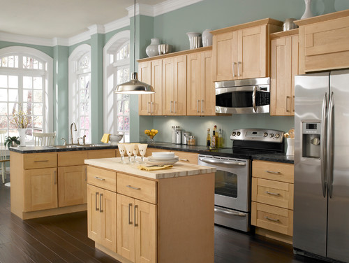 Love this wall color with the Maple cabinets and dark wood ...