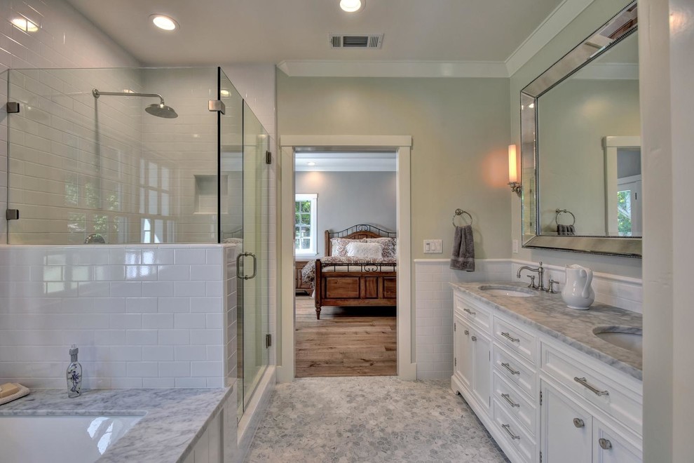 Inspiration for a mid-sized country master bathroom in San Francisco with furniture-like cabinets, white cabinets, an undermount tub, a corner shower, black and white tile, mosaic tile, green walls, marble floors, an undermount sink and marble benchtops.