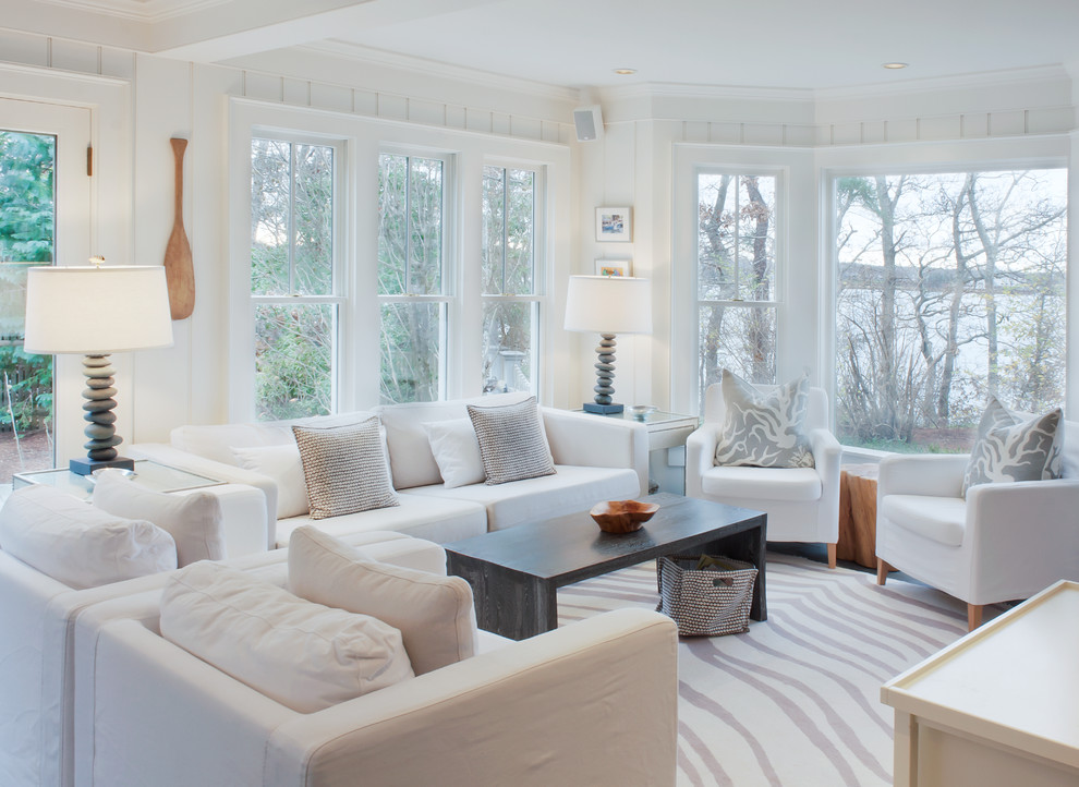 Beach style formal living room in Boston with white walls.