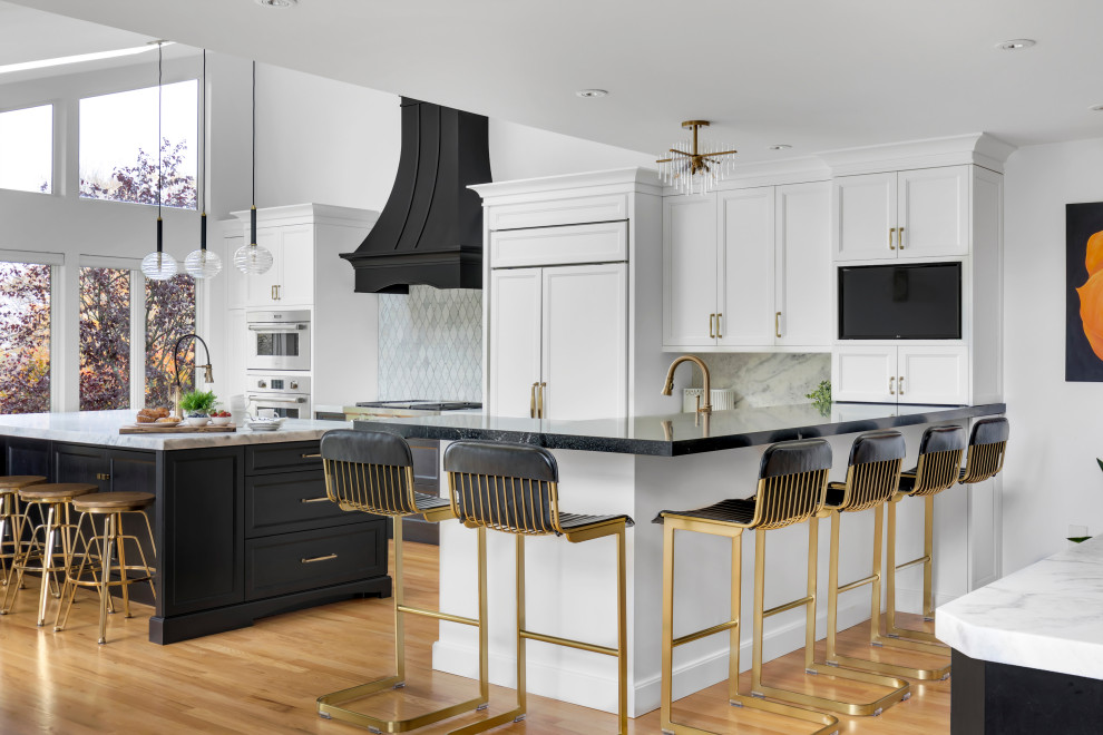 Design ideas for a large transitional l-shaped eat-in kitchen in New York with an undermount sink, shaker cabinets, white cabinets, quartz benchtops, white splashback, marble splashback, panelled appliances, light hardwood floors, with island, beige floor, white benchtop and vaulted.