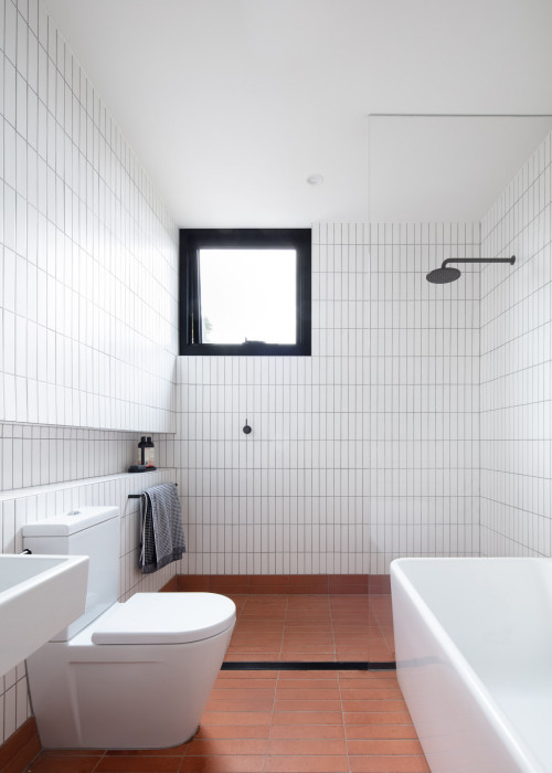 Bold Contrast Symphony: Brown Floor Tiles in Contemporary White Bathroom Design
