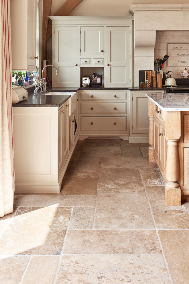 Design ideas for a traditional kitchen in Wiltshire with limestone floors.