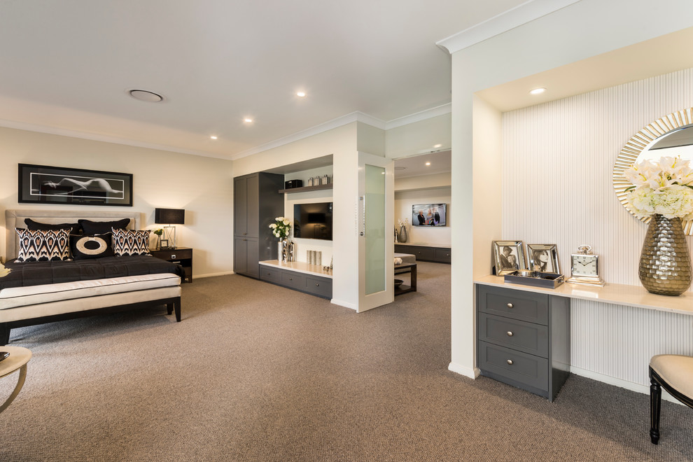 Large contemporary master bedroom in Brisbane with beige walls and carpet.
