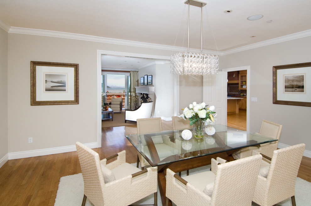 Inspiration for a beach style separate dining room in San Francisco with grey walls and medium hardwood floors.