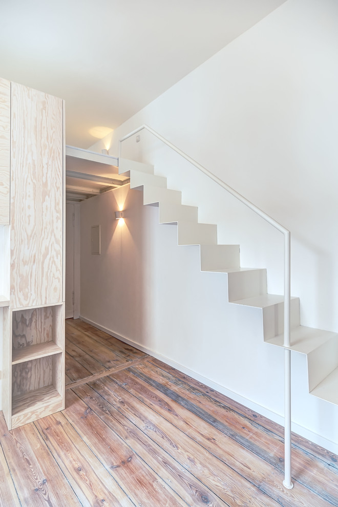 This is an example of a mid-sized contemporary metal straight staircase in Berlin with metal risers.