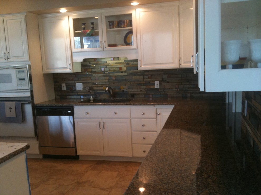 Kitchen - kitchen idea with glass tile backsplash