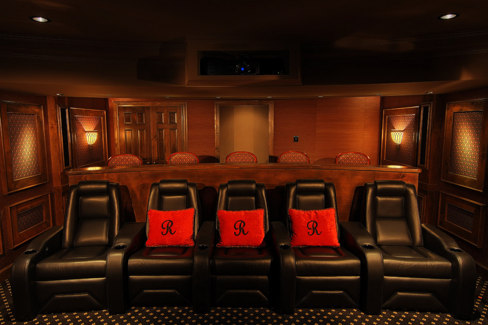 Inspiration for a large traditional enclosed home theatre in Other with red walls, carpet, a projector screen and multi-coloured floor.